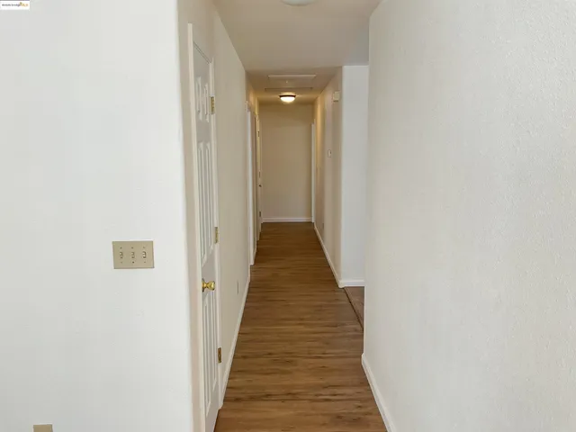 a view of a hallway with a glass door