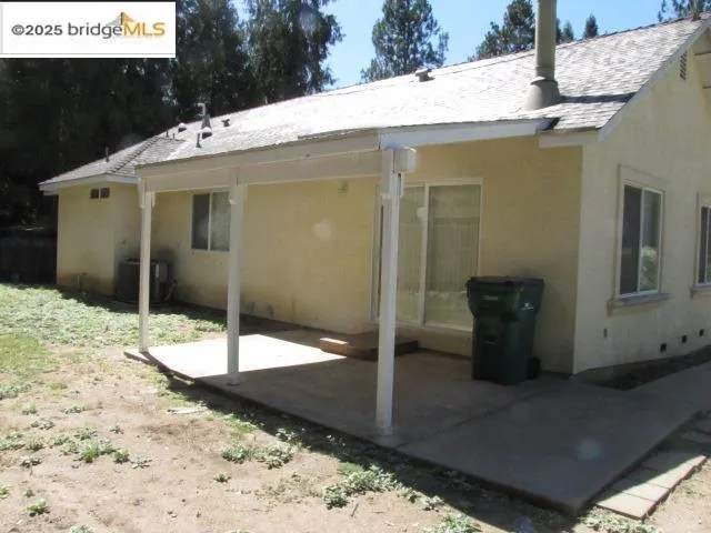 a patio with table and chairs
