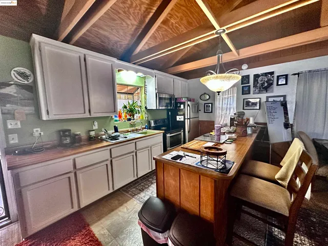 a kitchen with stainless steel appliances granite countertop a stove a sink dishwasher and cabinets