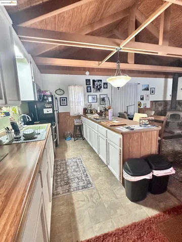 a kitchen with a stove and a cabinets