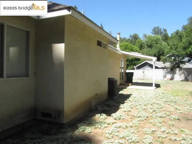 a view of a house with a snow in the background