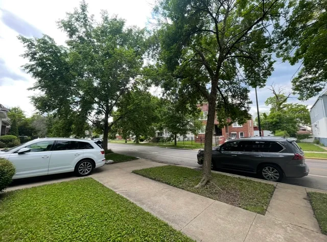 a view of a car parked in front of a house