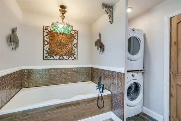 a bathroom with a sink a washer and dryer