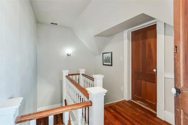 a view of entryway with wooden floor