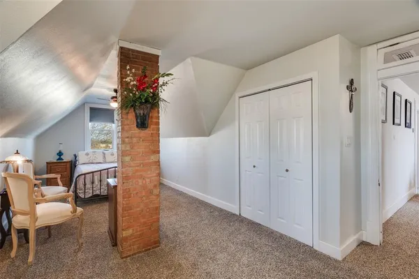 a living room with furniture and flowers