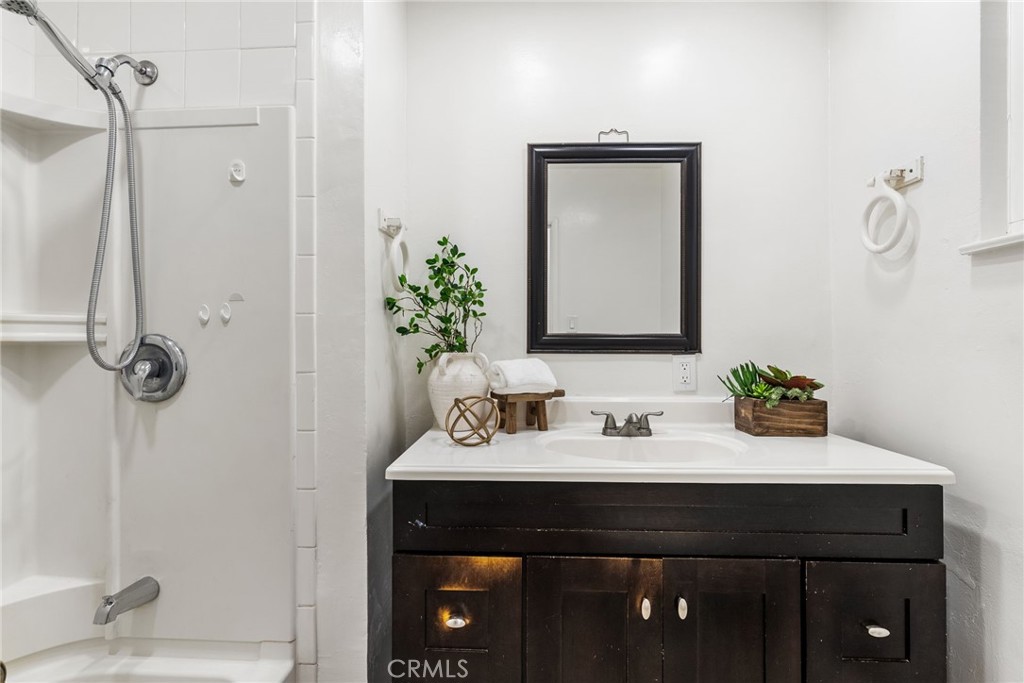 13361 Roxey Drive Garden Grove, CA 92843 - Photo 16 of 31 a bathroom with a sink and a mirror
