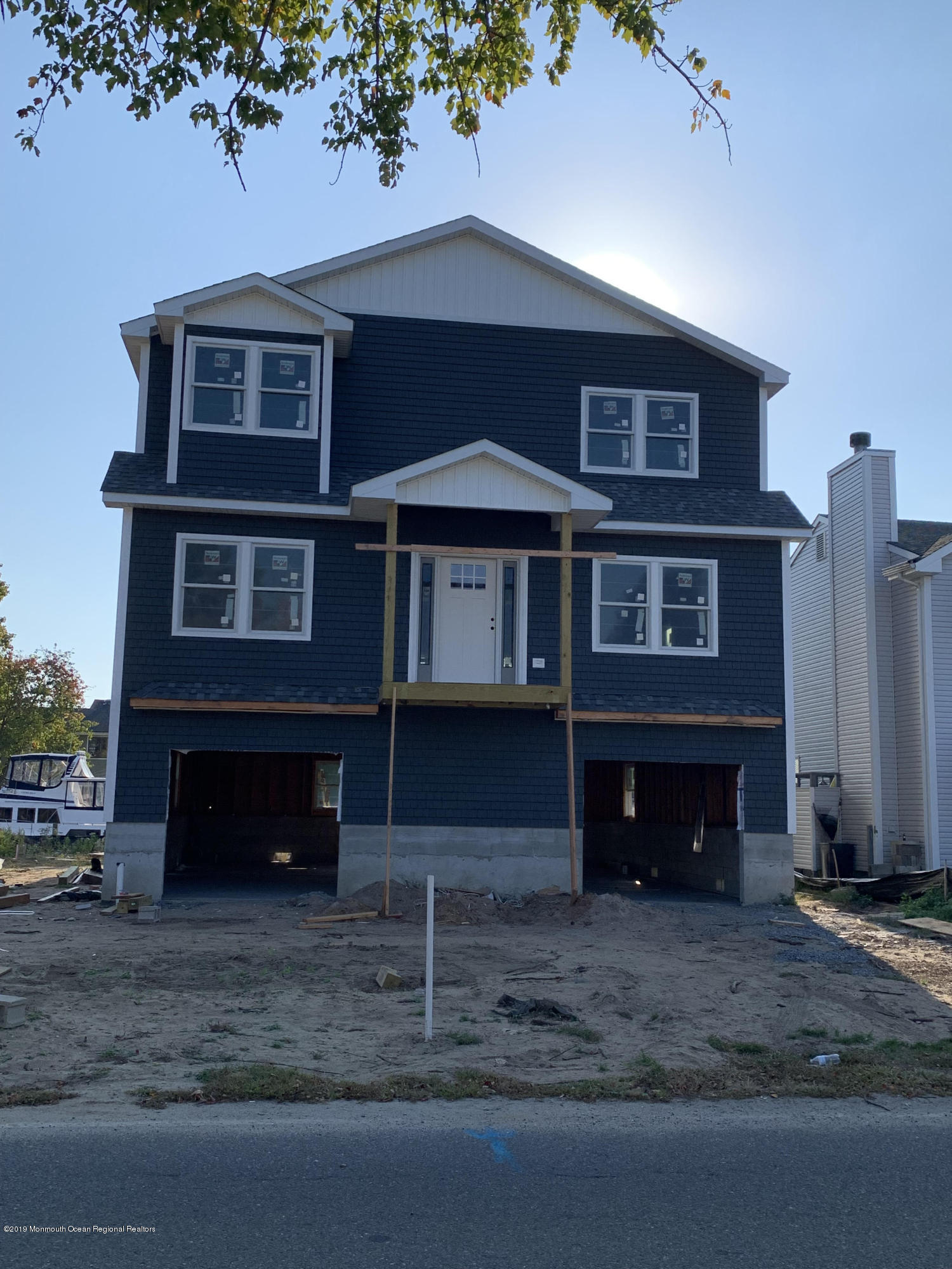 656 Drum Point Road, Unit B Brick, NJ 08723 - Photo 1 of 1 a front view of a house with a yard