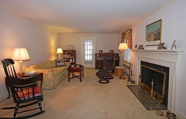 57 Emerson Road Wellesley, MA 02481 - Photo 4 of 9 a living room with furniture a fireplace and a window
