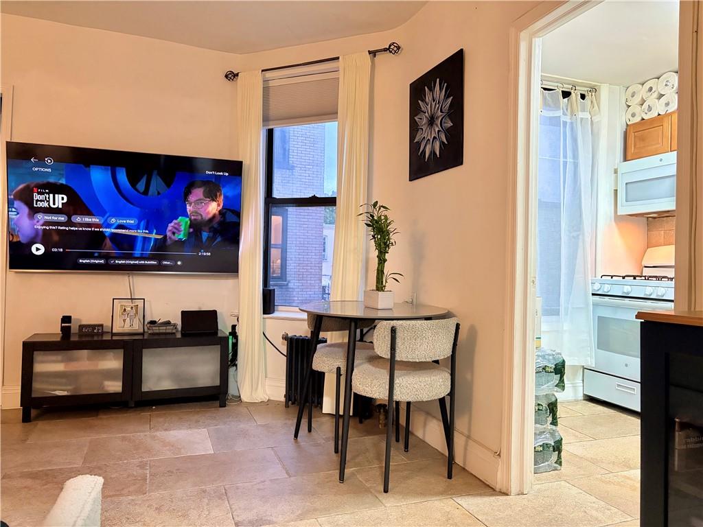 262 72nd Street Brooklyn, NY 11209 - Photo 2 of 5 a view of a livingroom with furniture and window
