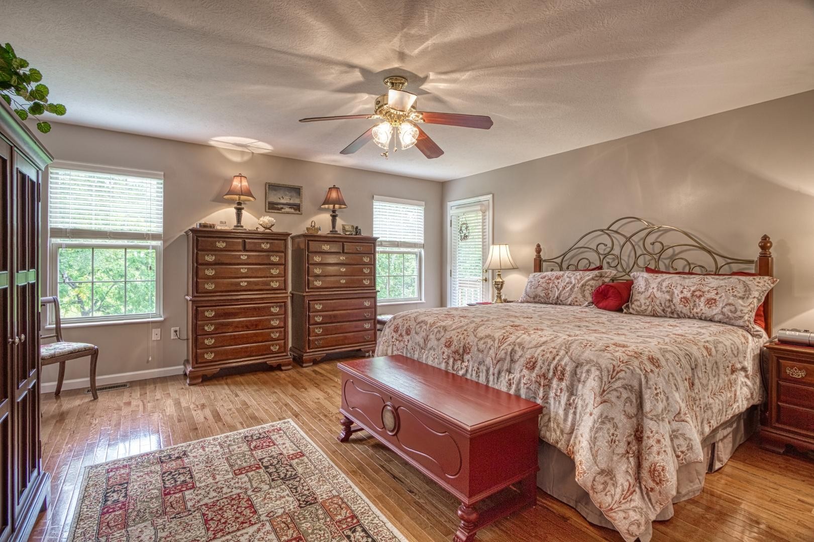 720 Rock House Road Kodak, TN 37764 - Photo 4 of 18 a bedroom with a bed and a chandelier