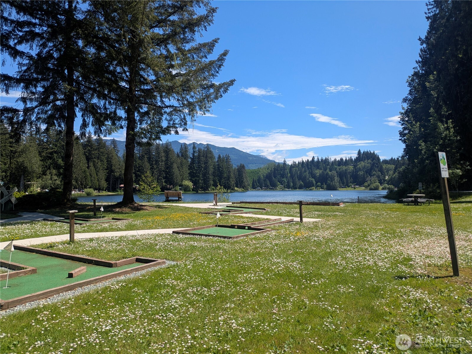 44957 Kachess Trail, Unit 2C97 Concrete, WA 98237 - Photo 15 of 16 a view of a swimming pool with a yard