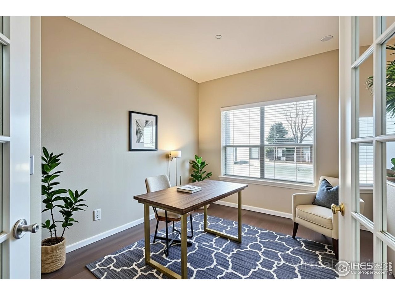 2834 Blue Jay Way Lafayette, CO 80026 - Photo 16 of 47 a living room with furniture a potted plant and a table