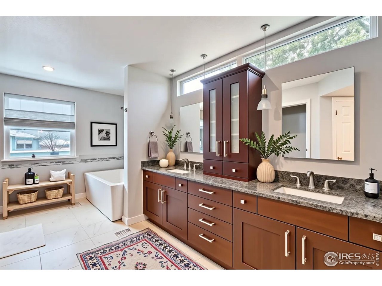 2834 Blue Jay Way Lafayette, CO 80026 - Photo 20 of 47 a spacious bathroom with a granite countertop sink mirror and a bathtub