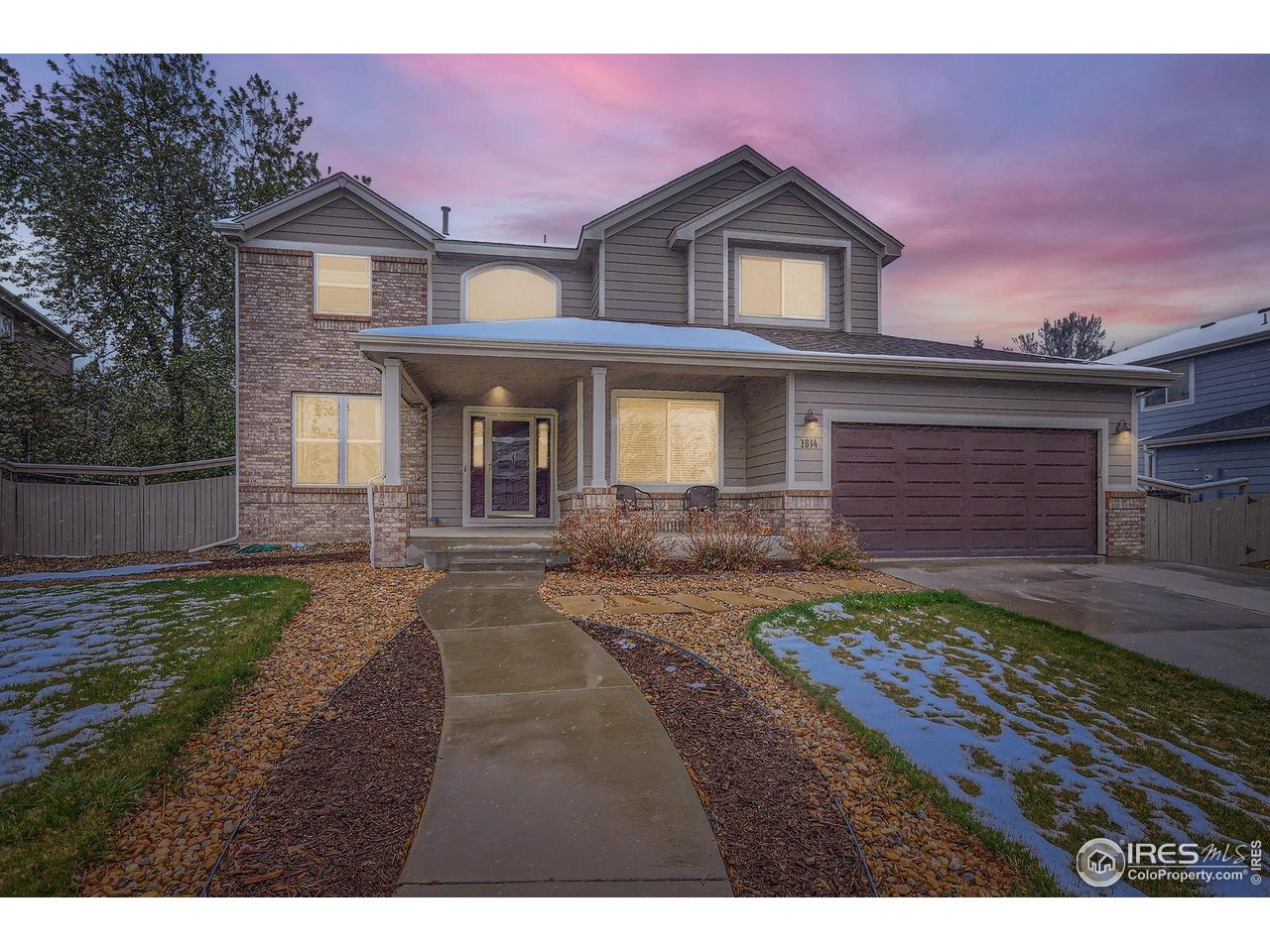 2834 Blue Jay Way Lafayette, CO 80026 - Photo 2 of 47 a front view of a house with garden