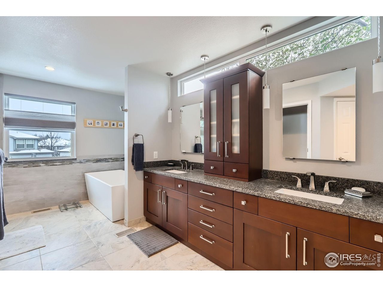 2834 Blue Jay Way Lafayette, CO 80026 - Photo 21 of 47 a bathroom with a granite countertop sink mirror and bathtub