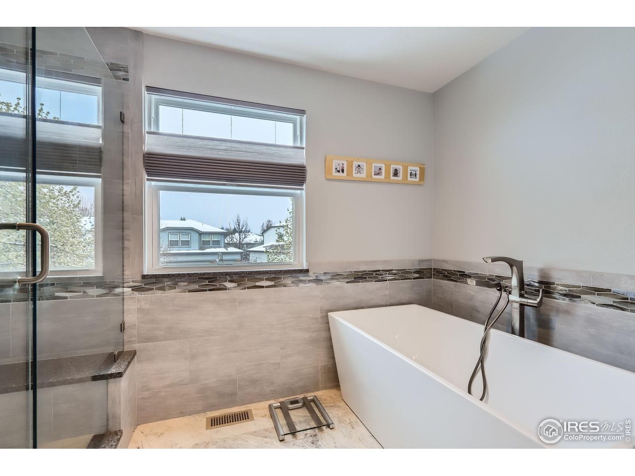 2834 Blue Jay Way Lafayette, CO 80026 - Photo 22 of 47 a bathroom with a tub a sink and a window