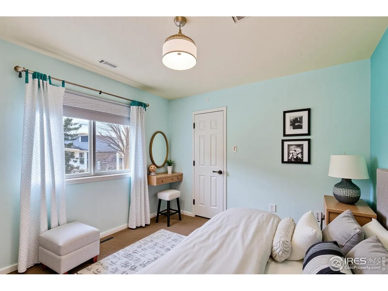 2834 Blue Jay Way Lafayette, CO 80026 - Photo 23 of 47 a bedroom with furniture and a window