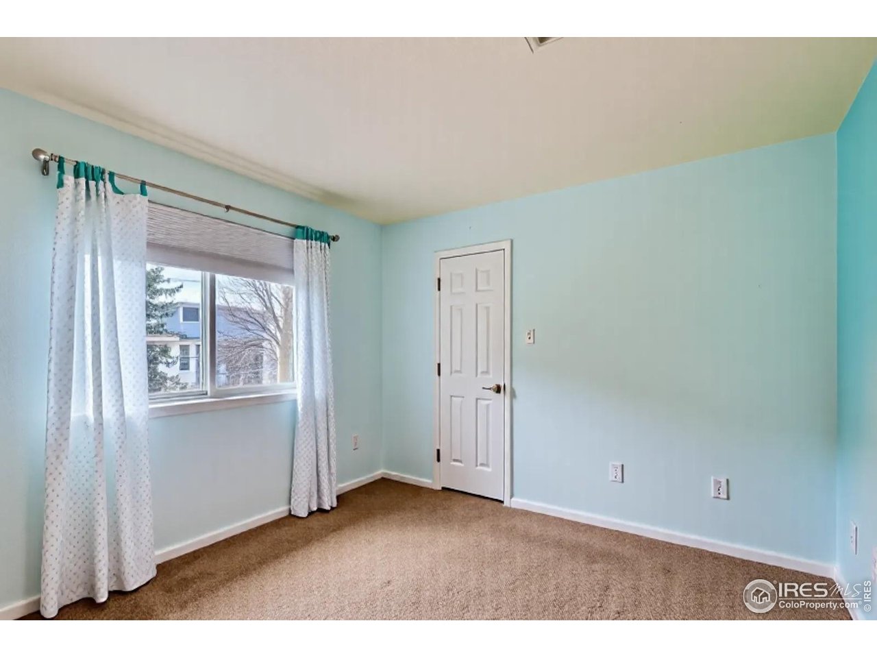 2834 Blue Jay Way Lafayette, CO 80026 - Photo 24 of 47 a view of an empty room with a window