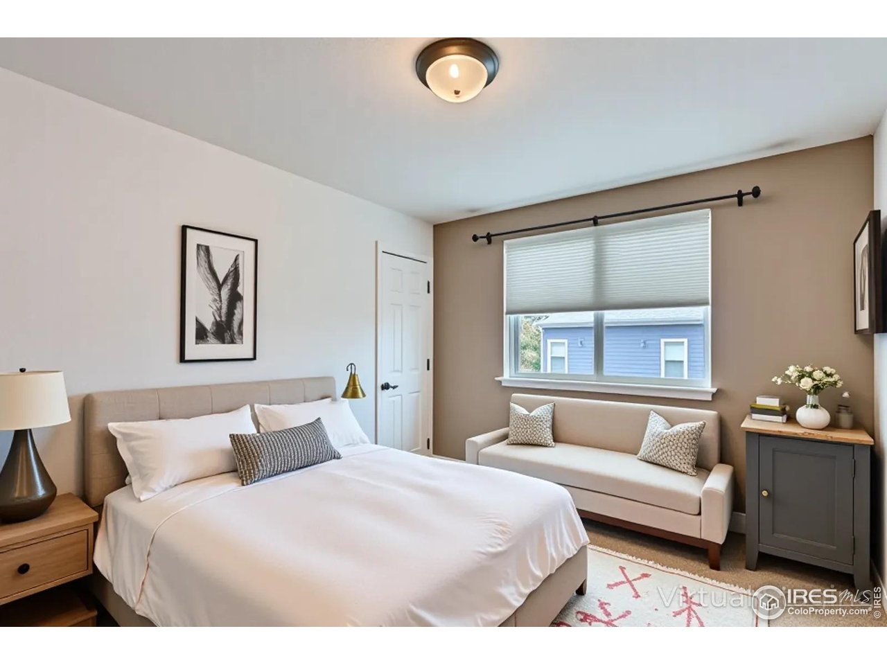 2834 Blue Jay Way Lafayette, CO 80026 - Photo 25 of 47 a bedroom with a bed and a couch