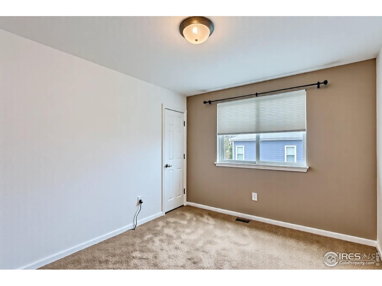 2834 Blue Jay Way Lafayette, CO 80026 - Photo 26 of 47 a view of an empty room with a window