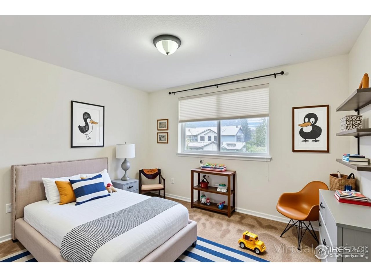 2834 Blue Jay Way Lafayette, CO 80026 - Photo 27 of 47 a bedroom with furniture and a wooden floor