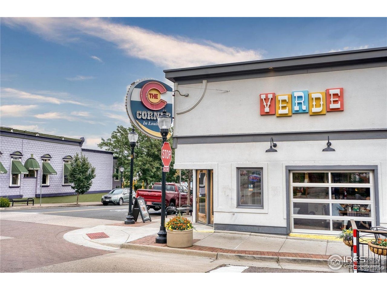2834 Blue Jay Way Lafayette, CO 80026 - Photo 46 of 47 a front view of a building with retail shops and traffic signal