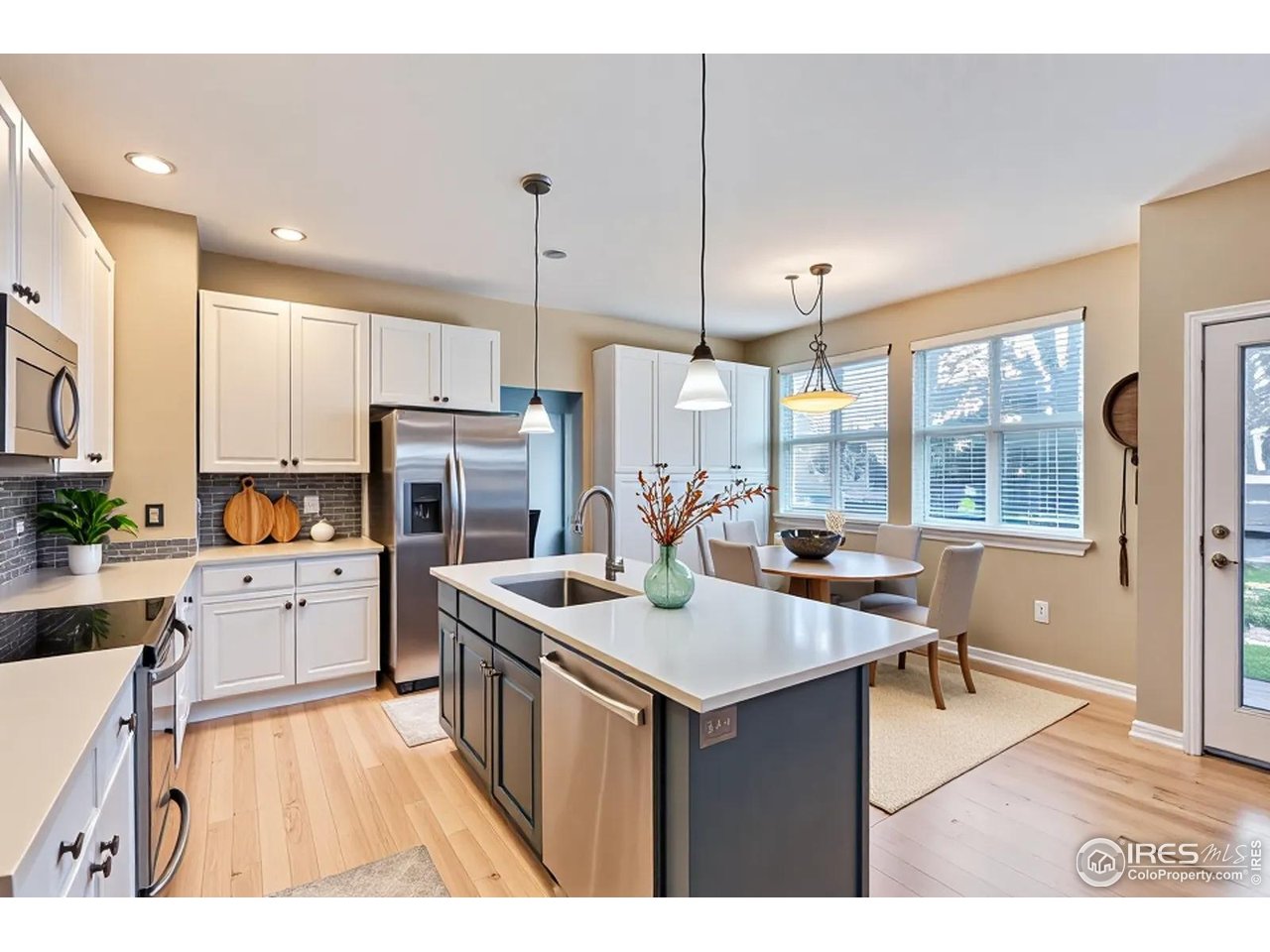 2834 Blue Jay Way Lafayette, CO 80026 - Photo 9 of 47 a kitchen with a sink stove and refrigerator
