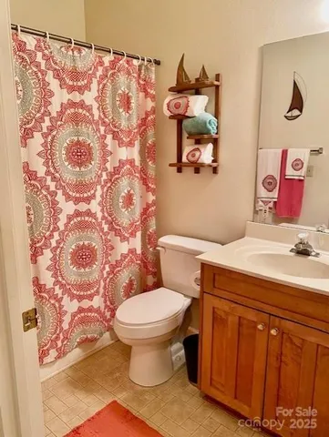 a bathroom with a toilet and a sink