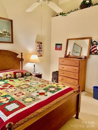 a bedroom with a bed and dresser