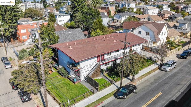 an aerial view of residential houses with yard