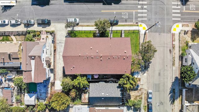an aerial view of multiple houses with yard