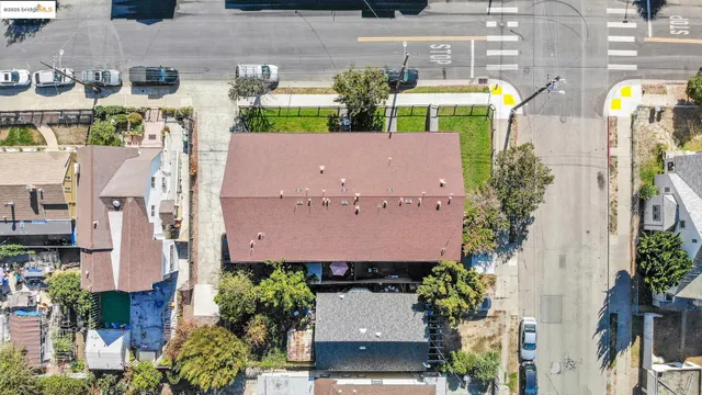 an aerial view of multiple houses with yard
