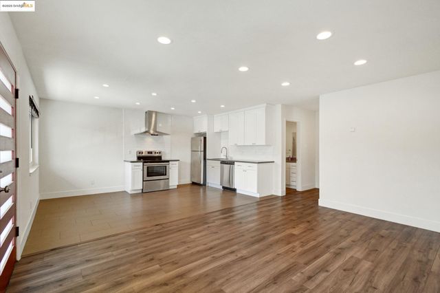 a view of kitchen with wooden floor
