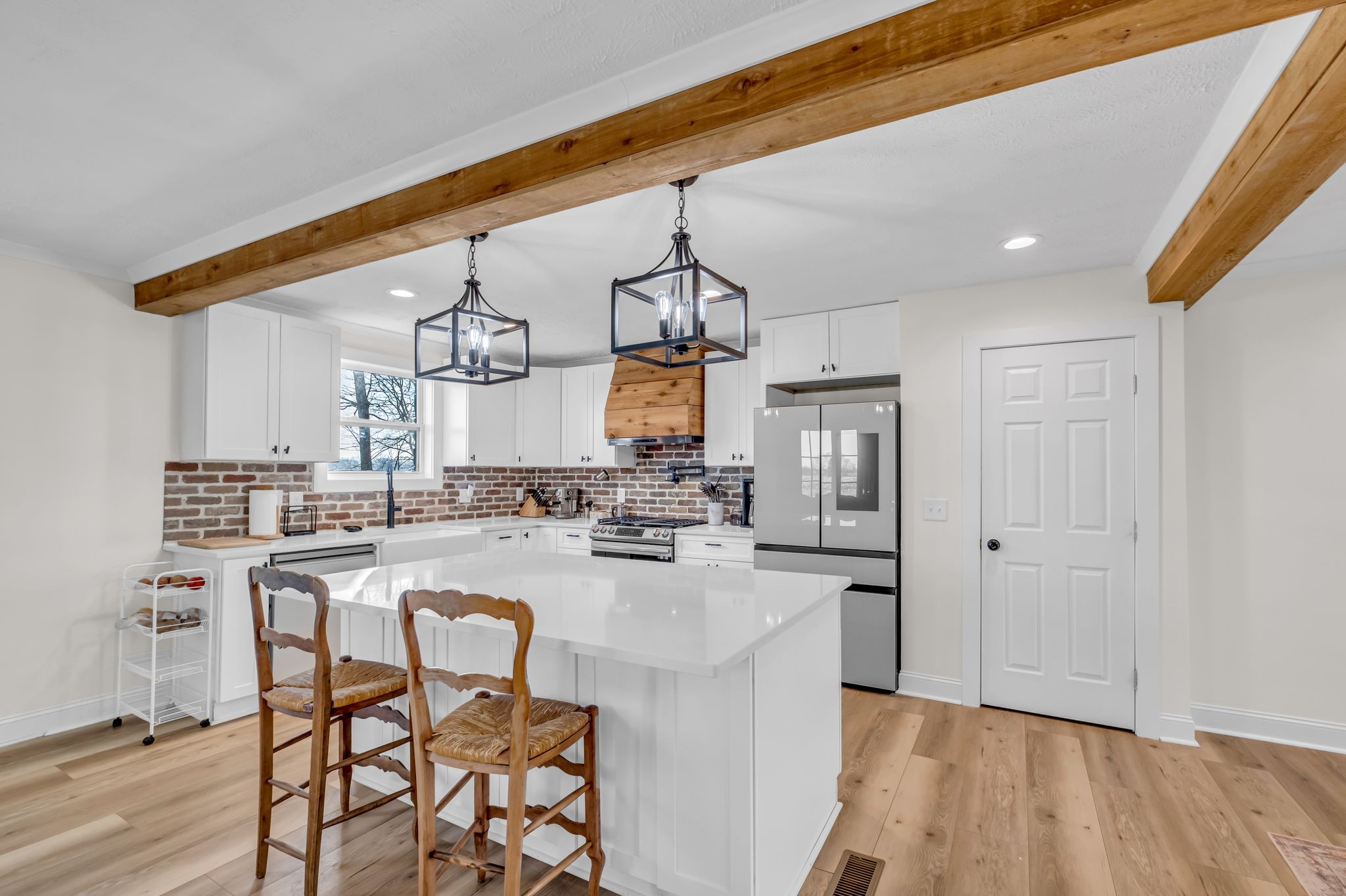 1447 Maxwell Branch Road Cottontown, TN 37048 - Photo 12 of 55 a open kitchen with a table and chairs in it