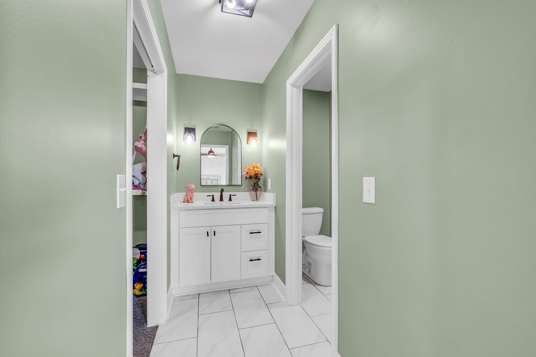 1447 Maxwell Branch Road Cottontown, TN 37048 - Photo 19 of 55 a bathroom with a sink and a mirror