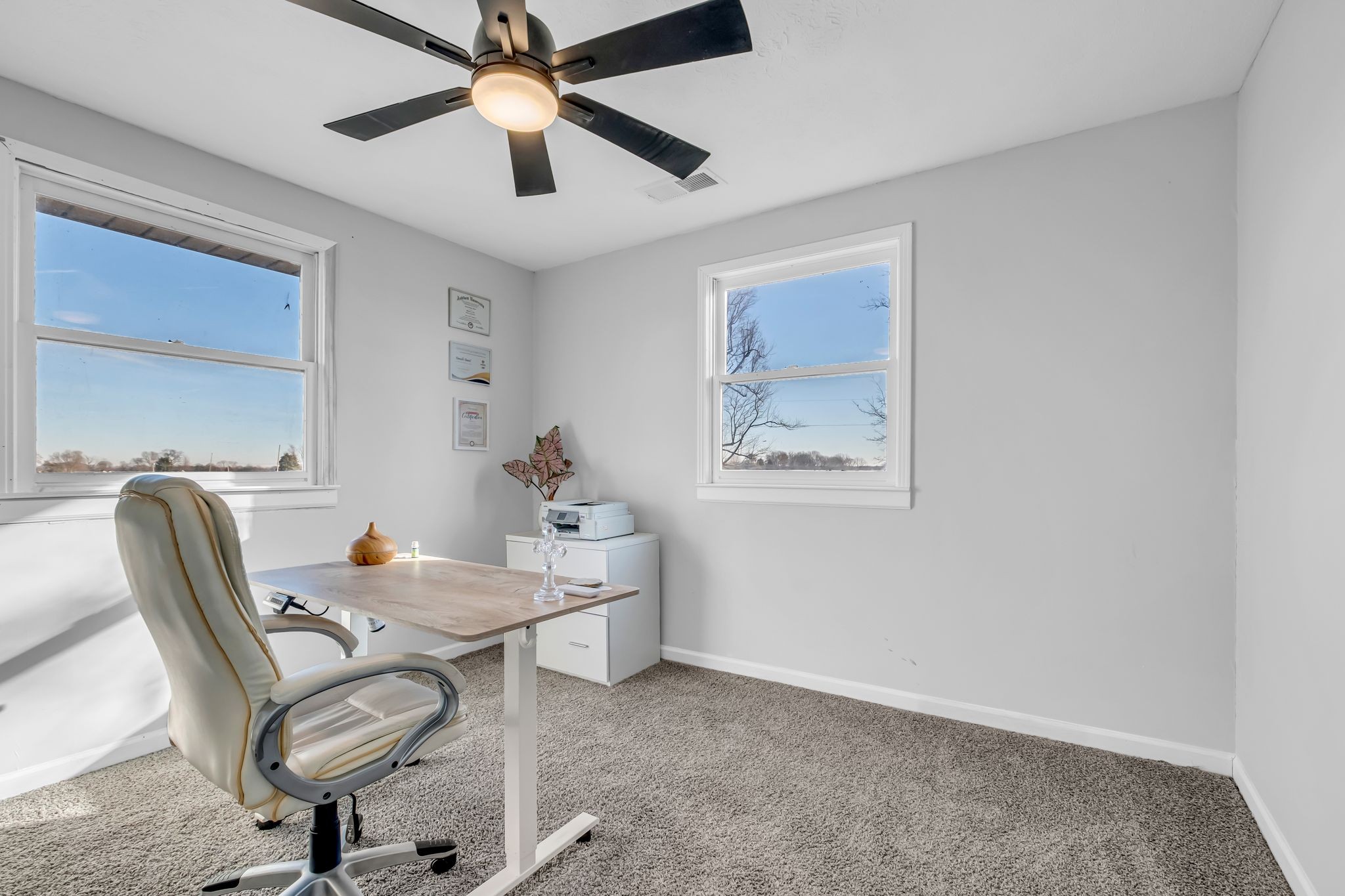 1447 Maxwell Branch Road Cottontown, TN 37048 - Photo 23 of 55 a workspace with furniture and chandelier fan