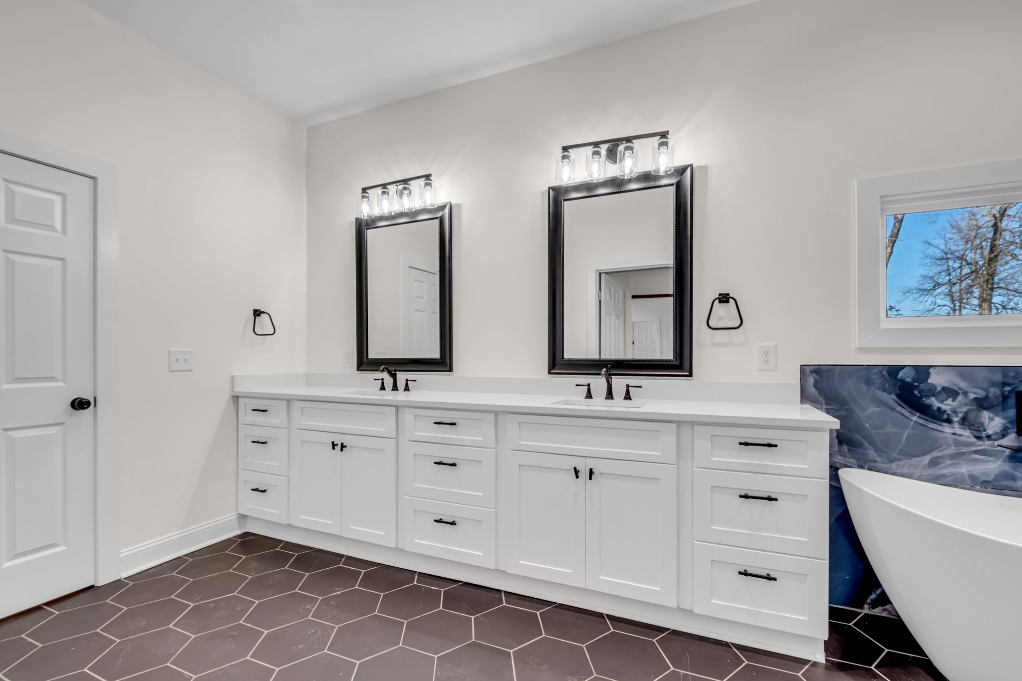 1447 Maxwell Branch Road Cottontown, TN 37048 - Photo 33 of 55 a spacious bathroom with double sink and a mirror