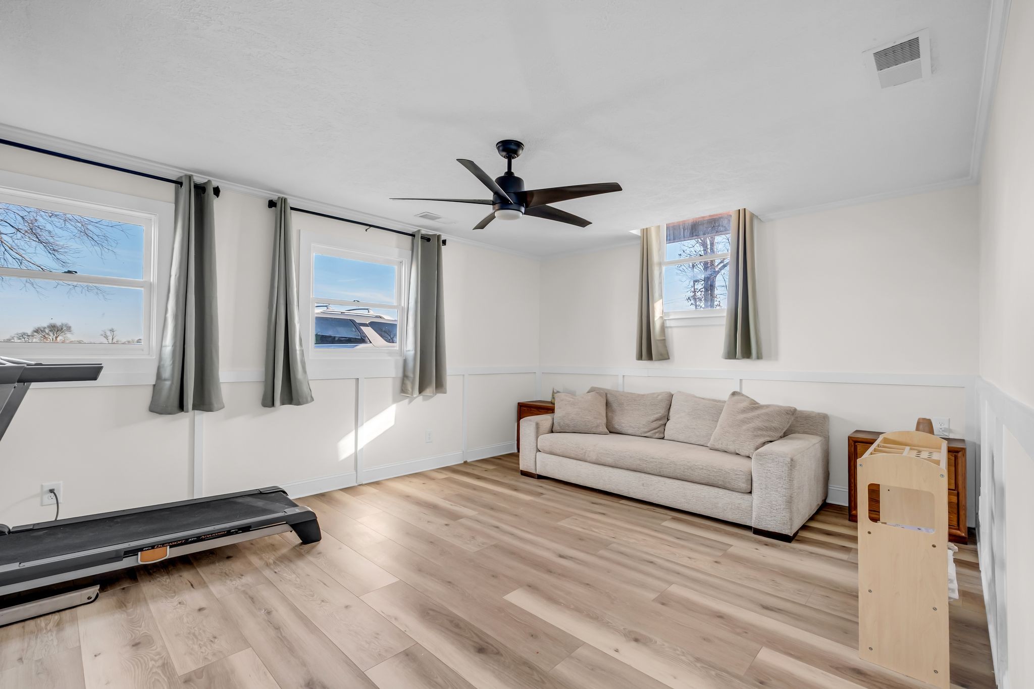 1447 Maxwell Branch Road Cottontown, TN 37048 - Photo 37 of 55 a living room with furniture and a ceiling fan
