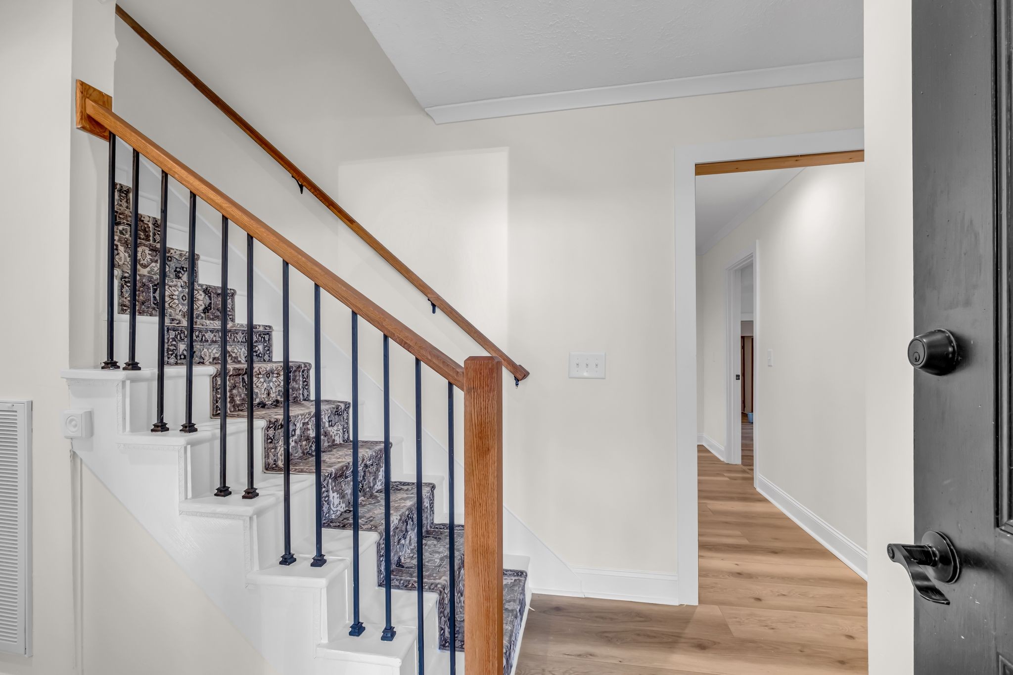 1447 Maxwell Branch Road Cottontown, TN 37048 - Photo 40 of 55 a view of a hallway with wooden floor and staircase