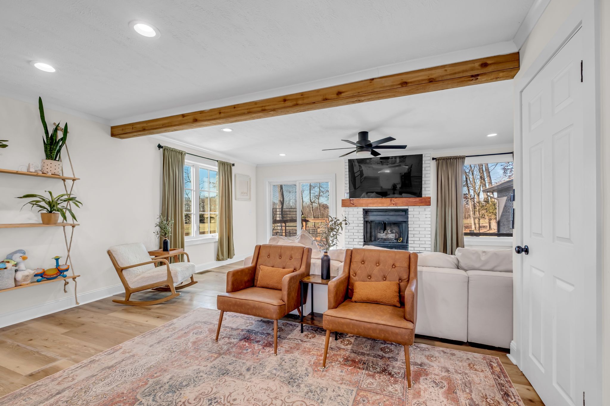 1447 Maxwell Branch Road Cottontown, TN 37048 - Photo 7 of 55 a living room with furniture and a flat screen tv