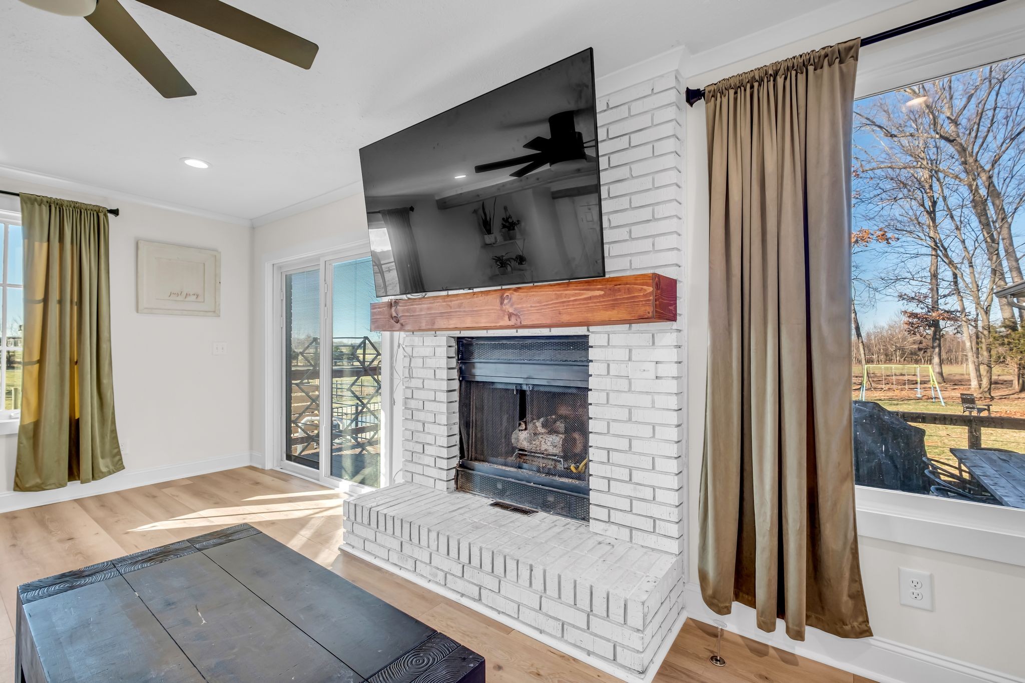 1447 Maxwell Branch Road Cottontown, TN 37048 - Photo 9 of 55 a view of a livingroom with a fireplace and stairs