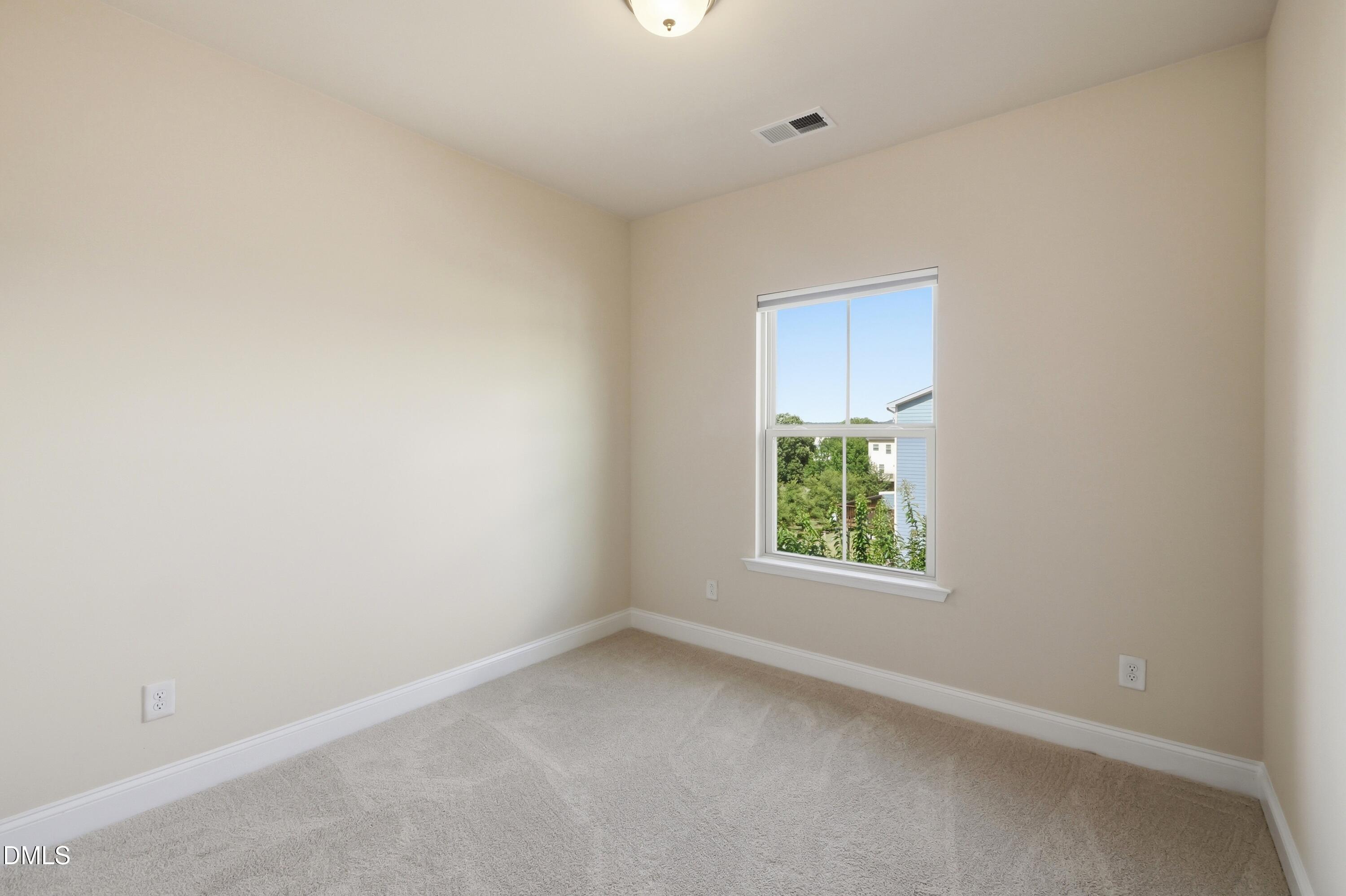 1004 Waymaker Court Apex, NC 27502 - Photo 22 of 30 an empty room with a window