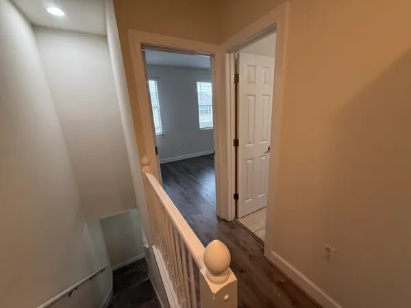 a bathroom with a granite countertop sink a toilet and shower