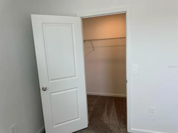 a view of a lake with houses in the background