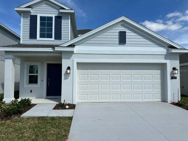 a bathroom with a sink a mirror and a shower