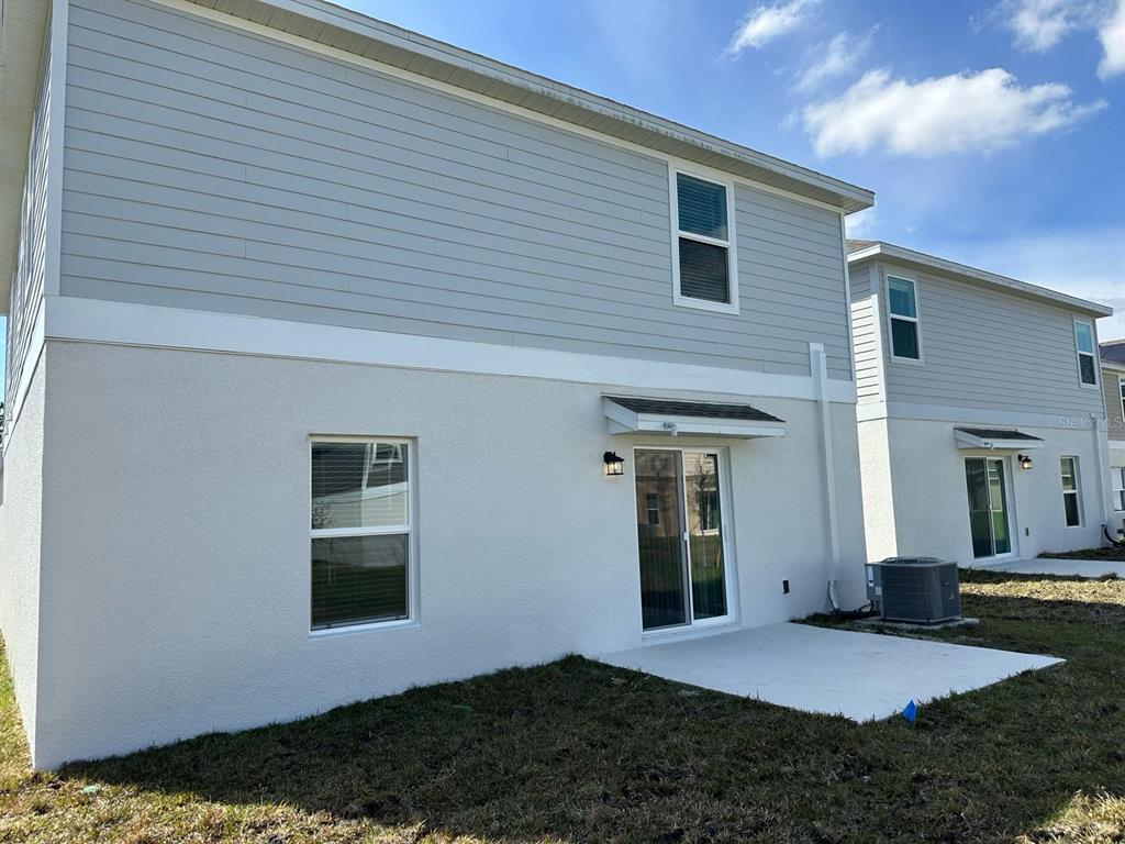 417 Cedar Key Street Davenport, FL 33837 - Photo 34 of 58 a view of backyard of house