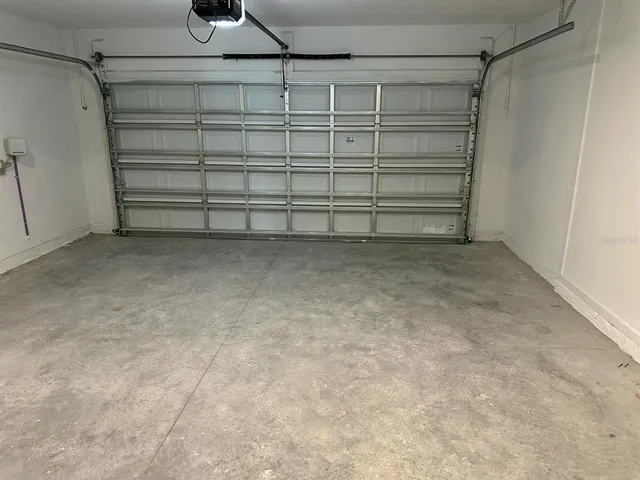 a kitchen with stainless steel appliances granite countertop a refrigerator a stove a sink and a refrigerator