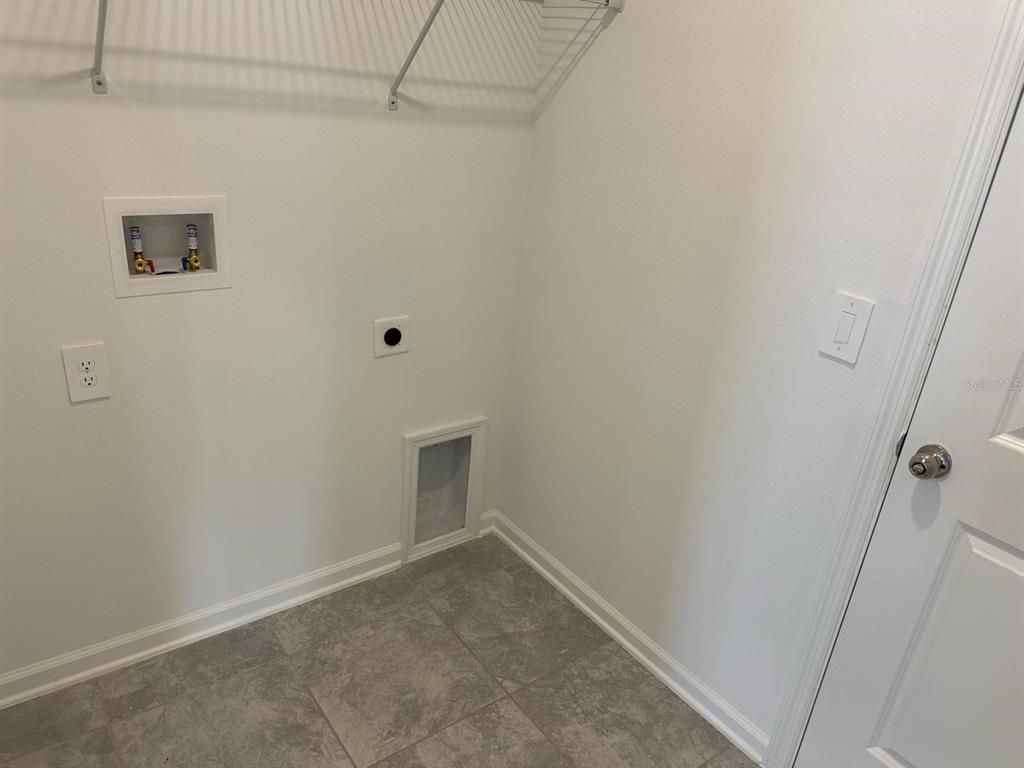 417 Cedar Key Street Davenport, FL 33837 - Photo 41 of 58 a view of room with window