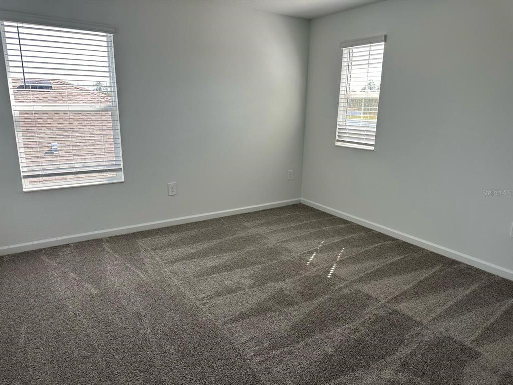 417 Cedar Key Street Davenport, FL 33837 - Photo 50 of 58 an empty room with a window