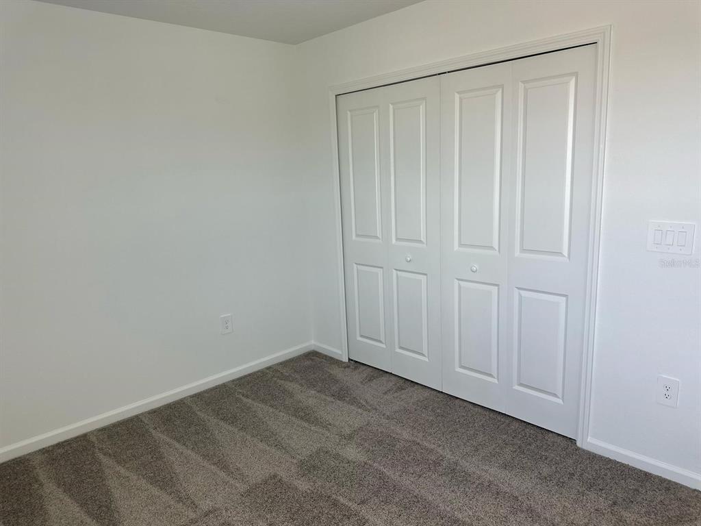 417 Cedar Key Street Davenport, FL 33837 - Photo 55 of 58 a view of an empty room